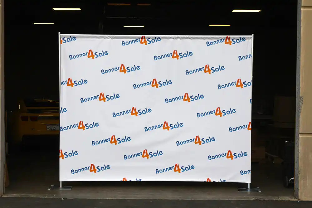 Step-and-repeat banner wall displaying repeated ’Business4Scale’ logos.